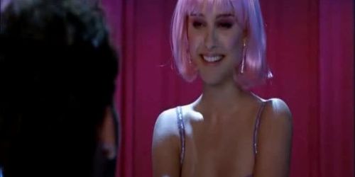 Glitzernde Stripperin im rosafarbenen Zimmer